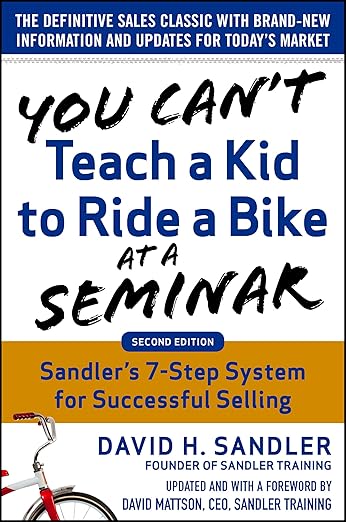 You Can't Teach a Kid to Ride a Bike at a Seminar by David Sandler book cover about sales coaching and learning
